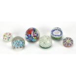 Six colourful glass paperweights including Millefiori and Perthshire examples, the largest 7.5cm
