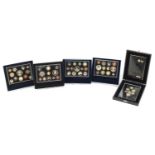 Four United Kingdom proof coin collections and a 2008 coinage Royal Shield of Arms proof