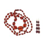Amber coloured faceted bead necklace with earrings, the necklace 84cm in length, approximate