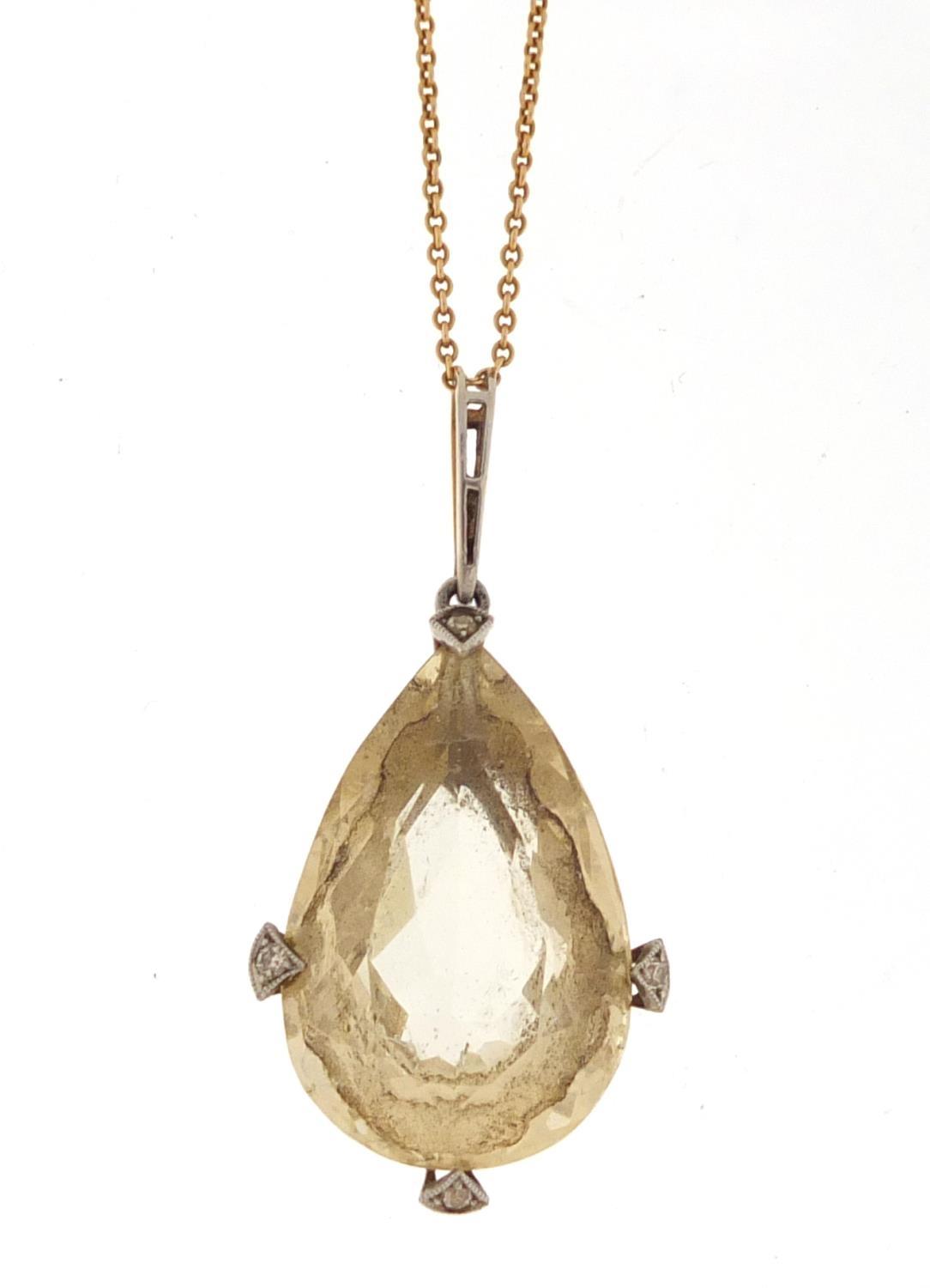 Unmarked gold citrine and diamond tear drop pendant on an unmarked gold necklace, the pendant 4.