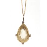 Unmarked gold citrine and diamond tear drop pendant on an unmarked gold necklace, the pendant 4.