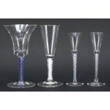 Four George III style glasses including three with air twist stems, the largest 17.5cm high : For