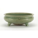 Chinese celadon glazed tripod incense burner, incised under glaze with foliage, 28.5cm in diameter :
