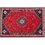 Persian Shriaz red and blue ground rug, decorated with birds and geometric design, 310cm x205cm :