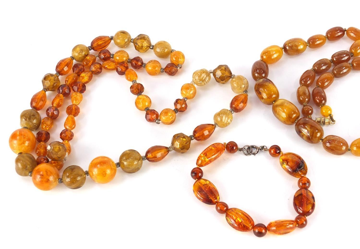 Three amber coloured bead necklaces and a bracelet, the largest 68cm in length, approximate weight - Image 2 of 6