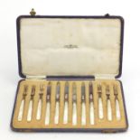 Set of six silver and mother of pearl knives and forks by Alexander Clark & Co Ltd, housed in a