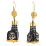 Pair of Islamic unmarked gold mounted glass earrings, hand painted with face masks, 5cm in length,