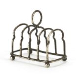 Victorian miniature silver four slice toast rack by Haseler Brothers, Chester 1902, 7.2cm in length,