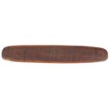 Aboriginal parrying shield carved with tribal motifs, 77cm in length : For Further Condition Reports