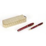 Conway Stewart 84 red marbleised fountain pen and propelling pen set with fitted box, the pen with