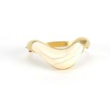 1970's modernist unmarked gold and ivory bangle, (tests as 18ct), 7cm wide, approximate weight 52.4g