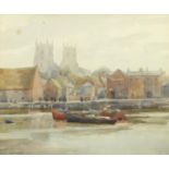 Moored boats before a town, watercolour, bearing a signature L G Walpole, mounted and framed, 36.5cm