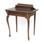 Edwardian mahogany escritoire, the top with pen box and tooled leather top above a drawer on