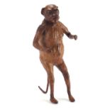 Victorian leather monkey with beaded glass eyes, 36cm high : For Further Condition Reports and