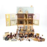 Large wooden dolls house with a large selection of furniture and accessories, the house with The