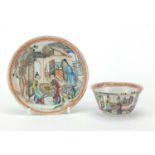 Chinese porcelain tea cup and saucer, finely hand painted in the famille rose palette with figures