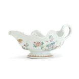 Chinese porcelain sauce boat, hand painted in the famille rose palette with flowers, 24cm in