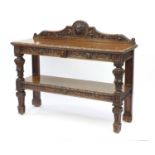 Oak two tier buffet with lion mask and leaf carvings, 112cm H x 137cm W x 45cm D : For Further