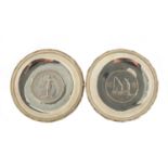 Two Chinese sterling silver coin dishes, both with impressed marks, each 9cm in diameter,