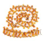 Butterscotch amber coloured necklace and a bracelet, the necklace 50cm in length, approximate weight