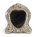 Love heart shaped silver easel mirror with bevelled glass and embossed with cupid by Carrs, 21cm