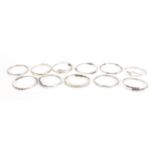 Eleven silver coloured metal bangles some marked 925, approximate weight 134.4g : For Further