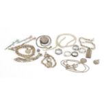 Silver and white metal jewellery including a Victorian style locket, rings and necklaces,