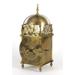 17th century style brass lantern clock striking on a bell, the dial with Roman numerals, 39.5cm high