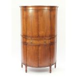 Inlaid walnut bow fronted cocktail cabinet, fitted with a pair of doors above a mixing shelf with