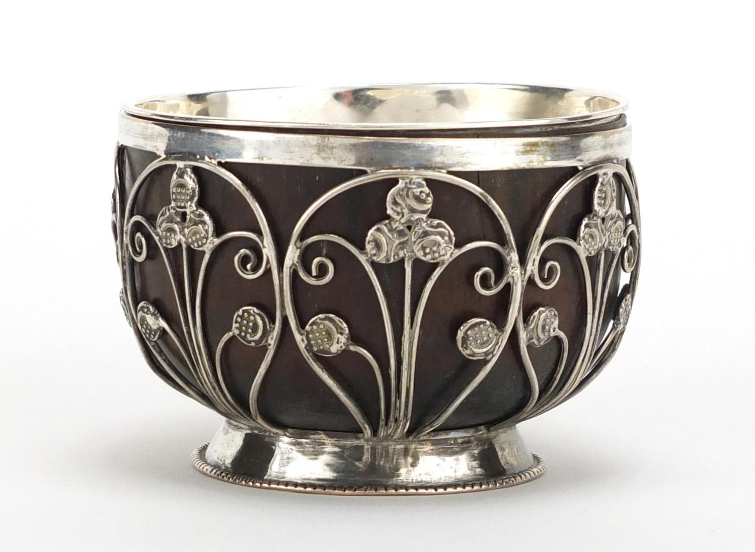 Unmarked silver coconut footed bowl, set with miniature Middle Eastern coins, 5.5cm high : For