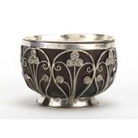 Unmarked silver coconut footed bowl, set with miniature Middle Eastern coins, 5.5cm high : For
