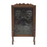 Arts & Crafts oak fire screen, the coppered panel with stylised flowers, 75cm high : For Further