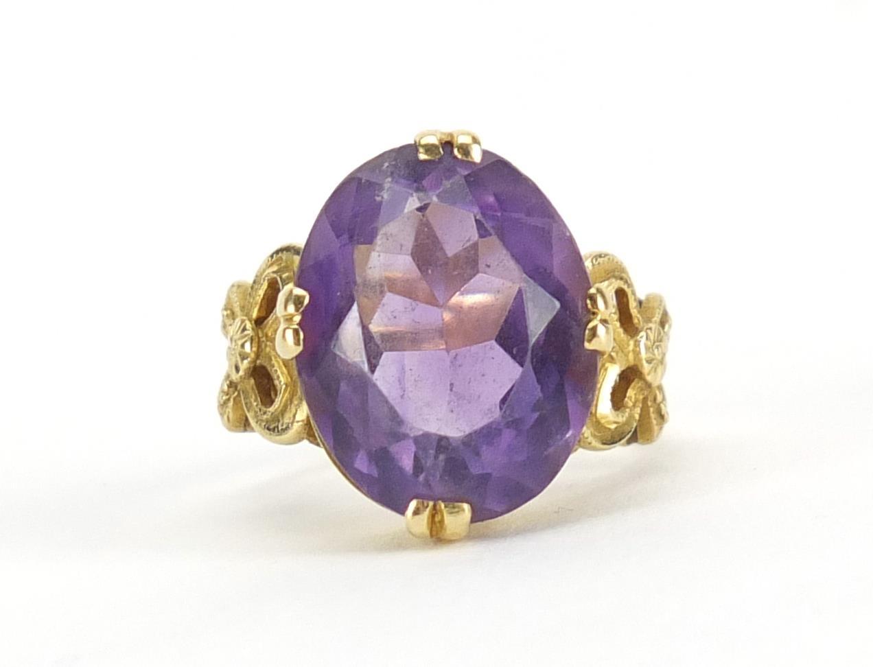 18ct gold amethyst solitaire ring, with bow design shoulders, size F, approximate weight 6.0g :