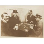 Black and white press photograph of Hitler playing cards, not for publication stamp to the
