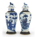 Pair of Chinese blue and white crackle glazed baluster vases and covers, hand painted with