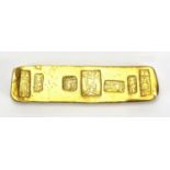 Chinese gold coloured metal scroll weight, 8.2cm wide, approximate weight 82.9g : For Further