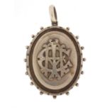 Victorian aesthetic unmarked silver locket, 5.8cm in length, approximate weight 23.2g : For