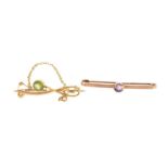 Unmarked gold peridot and seed pearl bar brooch and a 9ct gold amethyst bar brooch, the largest 4.