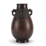 Chinese archaic style bronze vase with elephant head handles, six figure character marks to the