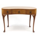 Waring & Gillow walnut kidney shaped dressing table with three drawers, on carved cabriole legs,