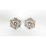 Pair of 18ct white gold diamond flower head earrings, 7mm in diameter, approximate weight 1.6g : For