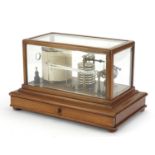 Negretti & Zambra barograph housed in a mahogany case with base drawer, registered number 476369,