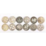 Twelve Chinese silver coloured metal coins including Queen Victoria design example : For Further