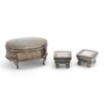 Oval silver four footed jewel box and two stamp boxes with ball feet, the jewel box Birmingham 1908,