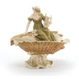 Royal Dux centre piece of a maiden playing a harp seated on a shell, factory marks and numbered 1932