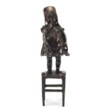 Patinated bronze figure of a young girl standing on a stool, 30cm high : For Further Condition