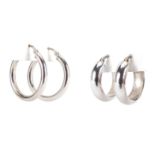 Two pairs of 9ct white gold hoop earrings, the largest 2.5cm in diameter, approximate weight 3.