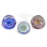 Four colourful faceted glass paperweights including an ER II Jubilee example, the largest 5.5cm high