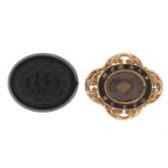 Two Victorian mourning brooches including one gilt metal and enamel, the largest 5cm wide : For