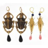 Two pair of Egyptian Revival earrings including a pair of beetle design with drops, the largest 9.